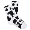 K. Bell Women's American Made Cow Print Crew Sock flat lay photo